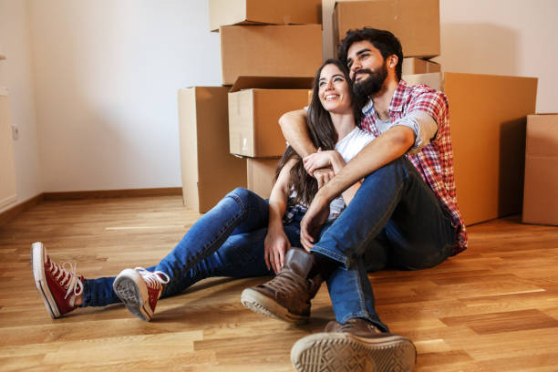 istock Young couple moving into a new home. 1058882114