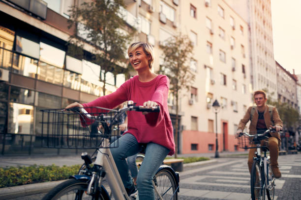 istock Friends Riding Bicycles In A City 1058882594