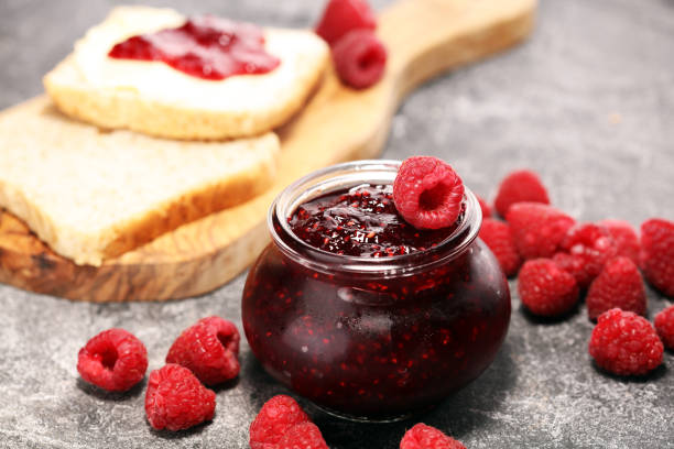 istock raspberry jam with fresh raspberries. marmalade in jar 1058882858