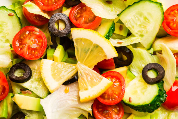 istock Mix green and red vegetables in salad texture background 1058883010