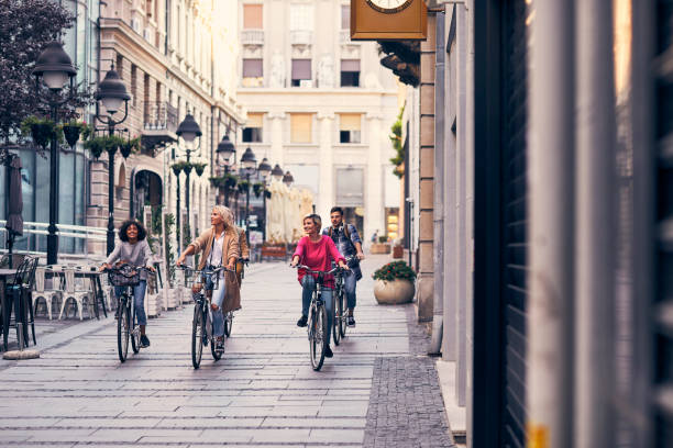 istock Friends Riding Bicycles In A City 1058883294