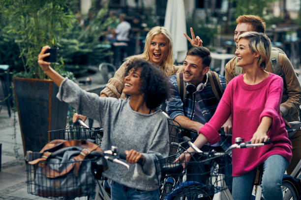 istock Friends Riding Bicycles In A City 1058884558