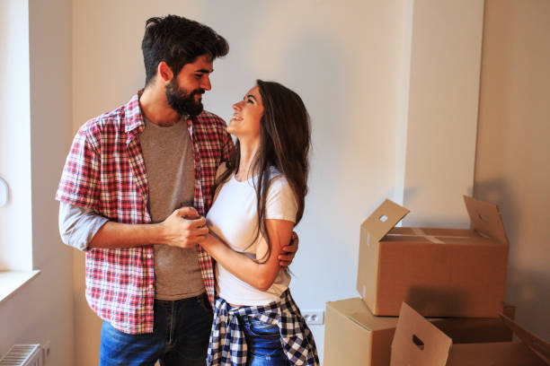 istock Young couple moving into a new home. 1058884802