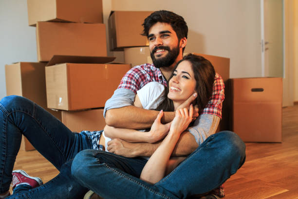 istock Young couple moving into a new home. 1058884988