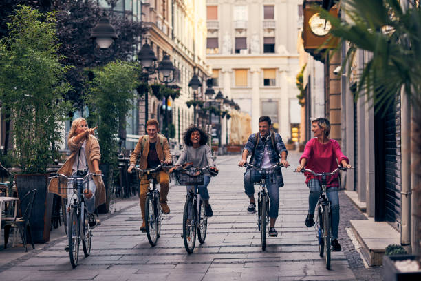 istock Friends Riding Bicycles In A City 1058885226