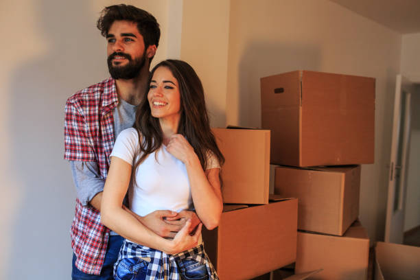 istock Young couple moving into a new home. 1058885354
