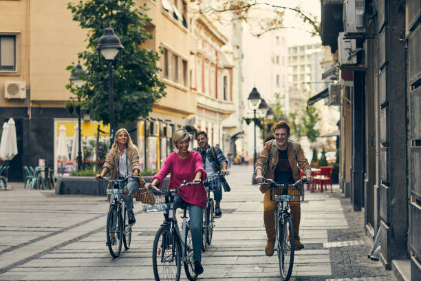 istock Friends Riding Bicycles In A City 1058885508