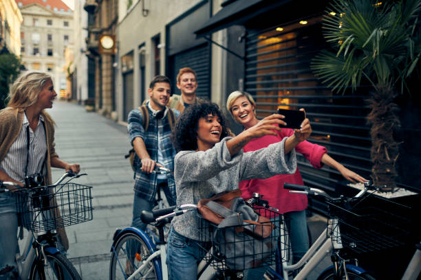 istock Friends Riding Bicycles In A City 1058885846