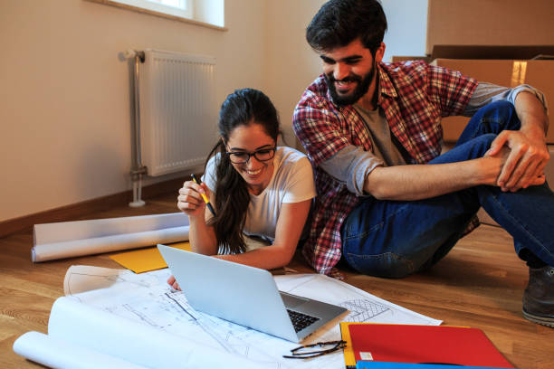 istock Young couple moving into a new house. 1058886234