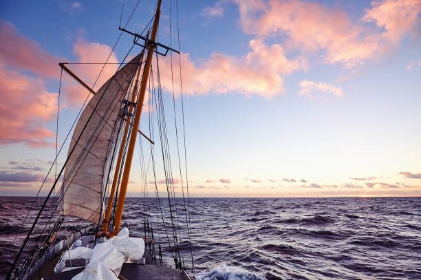 istock Old sailing ship mast at sunset. 1058886474
