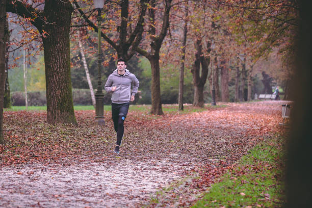 istock Autumn run in the park 1058886492