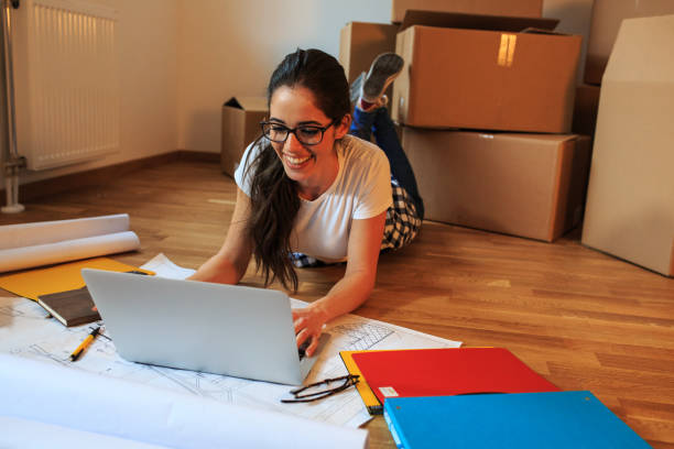 istock Young woman moving into a new apartment. 1058886612