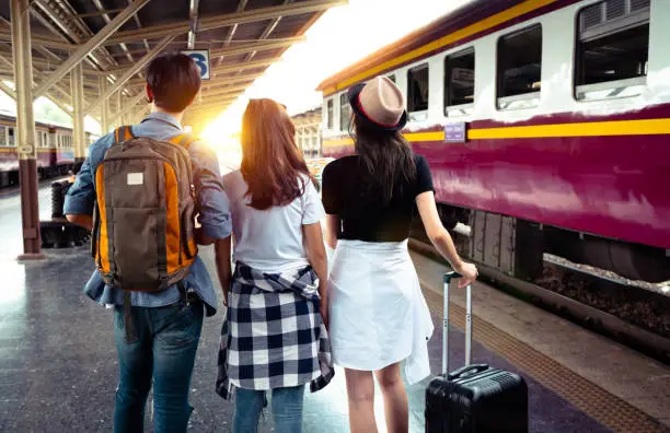 Photo of Group of tourist greeting and happiness after traveler by train