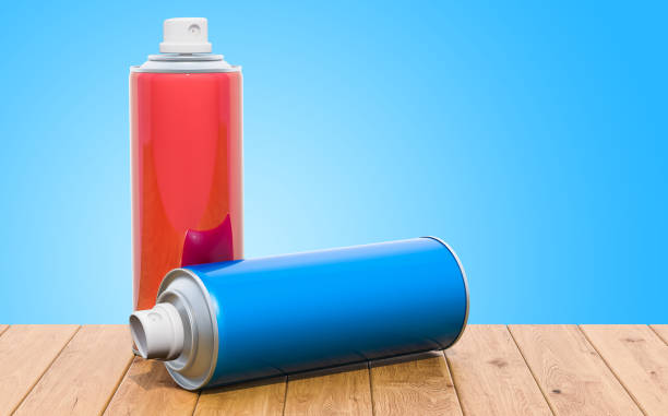 istock Spray paint cans on the wooden table, 3D rendering 1058889922