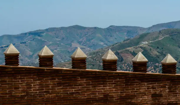 Photo of Typical Moorish defensive walls in a small town of Andalusia, a historic element of architecture
