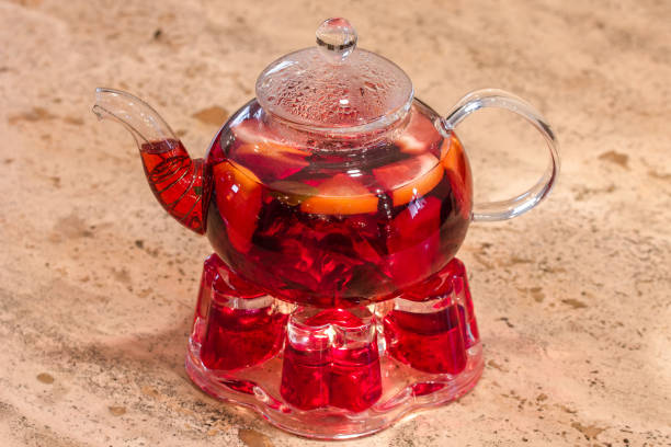 istock Glass teapot with red fruit tea 1058893072