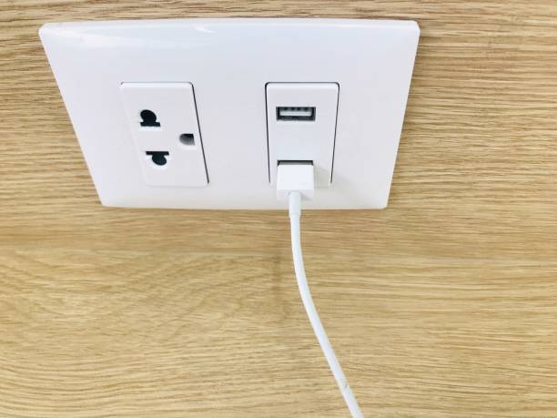 istock New wall outlet socket with USB 5V 2.1A included. For convenience, the mobile charger or smartphone in the concept of modern life. 1058898046