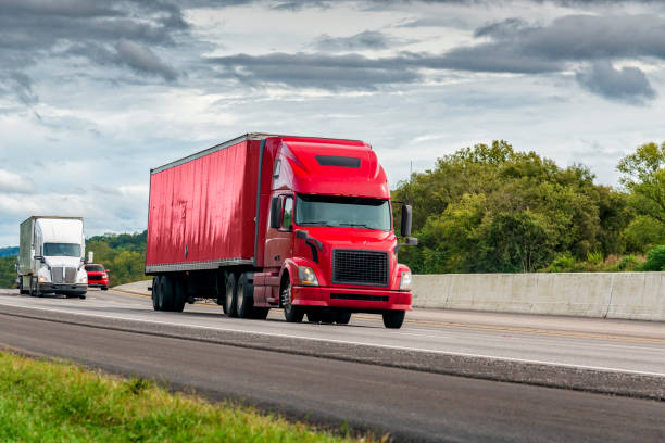 istock Red Semi Tractor-Trailer Travels The Interstate Highway 1058907890