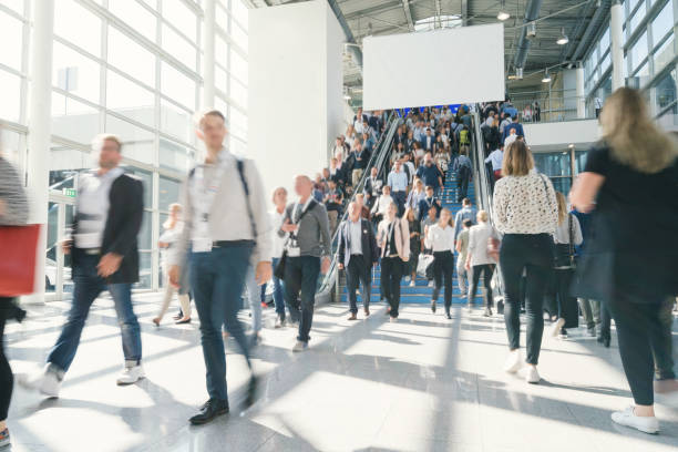 blurred business people blurred business people at a trade fair exhibition stock pictures, royalty-free photos & images