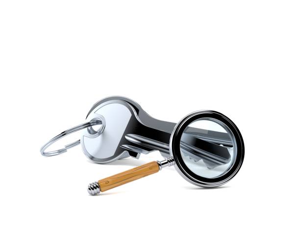 istock Door keys with magnifying glass 1058914458