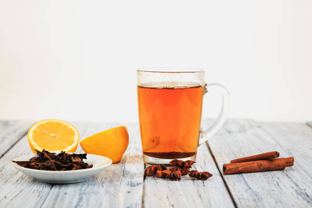istock tea and lemon halves on wooden table 1058914588