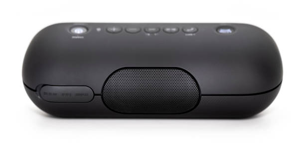 istock Black Bluetooth speaker with lights on isolated in white background 1058915224
