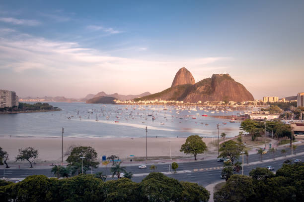 Aerial view of Botafogo, Guanabara Bay and Sugar Loaf Mountain at sunset - Rio de Janeiro, Brazil Aerial view of Botafogo, Guanabara Bay and Sugar Loaf Mountain at sunset - Rio de Janeiro, Brazil guanabara bay stock pictures, royalty-free photos & images