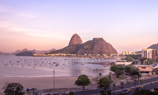 Aerial view of Botafogo, Guanabara Bay and Sugar Loaf Mountain with a pink sunset - Rio de Janeiro, Brazil