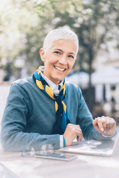 istock Smiling Senior Woman Working on Laptop 1058917456