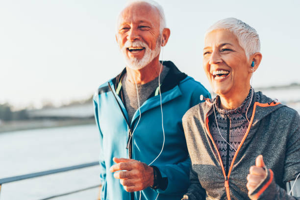 istock Senior couple jogging together 1058917492