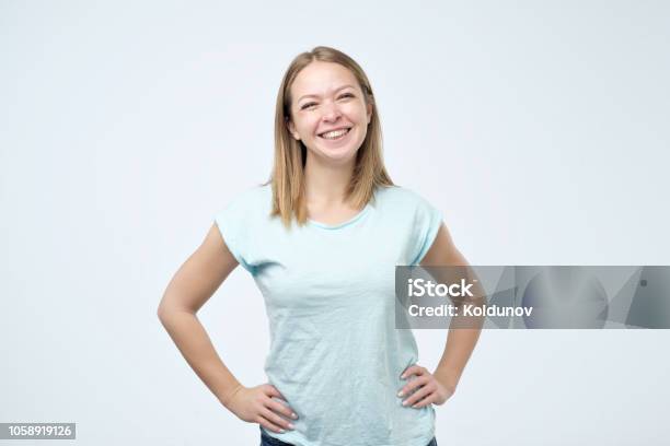 Beautiful Girl With Beautiful Smile In Studio Looking At Camera Portrait Positive Emotion Stock Photo - Download Image Now