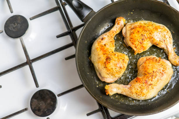 istock Fry chicken legs in a pan with spices. 1058922038
