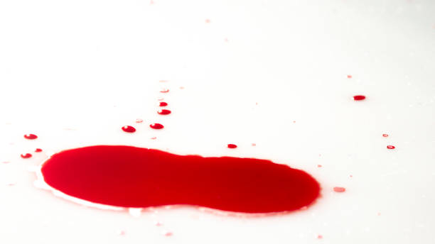 istock drops of red blood on white paper 1058924236