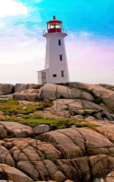 istock Scenic lighthouse with boulders in foreground and blue sky 1058935562