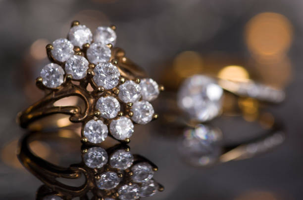 istock Golden ring on a gray background with a mirror image. 1058936734