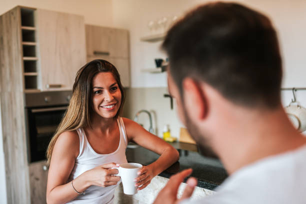 istock Close-up image of couple drinking morning coffee. 1058937202
