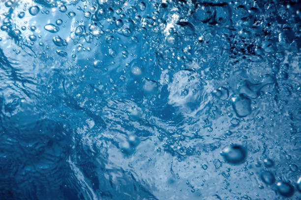 istock Underwater view of the water surface. Underwater background. 1058944384