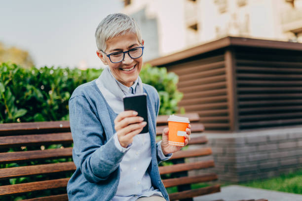 istock Senior woman usigg her smartphone 1058952518