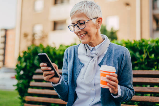 istock Senior woman usigg her smartphone 1058952550