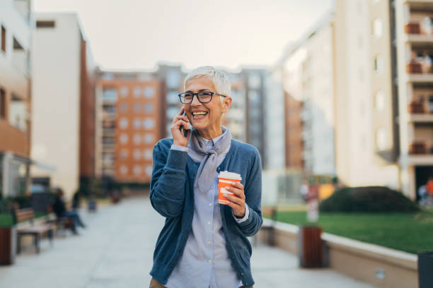 istock Senior woman usigg her smartphone 1058952590