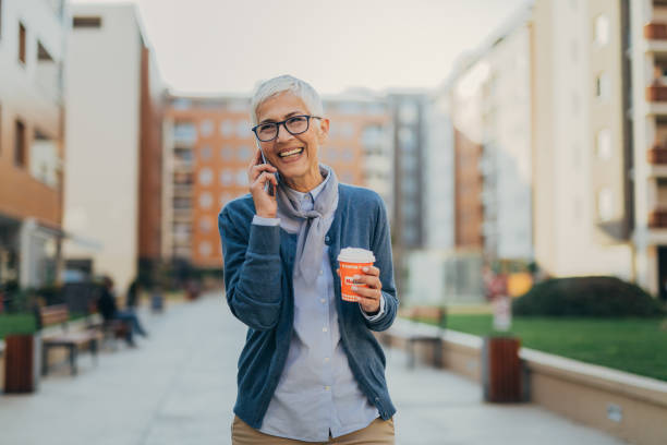 istock Senior woman usigg her smartphone 1058952594