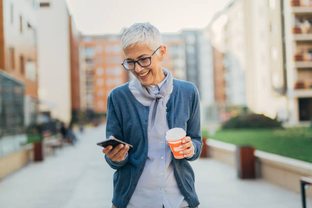 Senior woman usigg her smartphone
