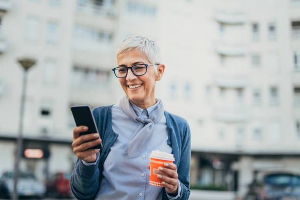 istock Senior woman usigg her smartphone 1058953690