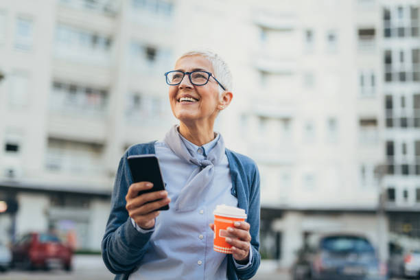 istock Senior woman usigg her smartphone 1058953692