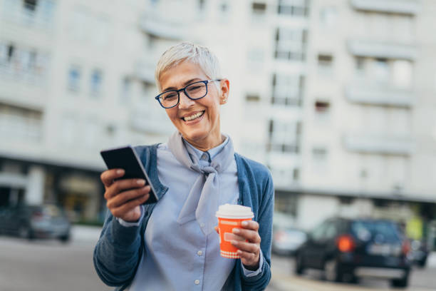 istock Senior woman usigg her smartphone 1058953714