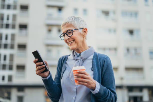 istock Senior woman usigg her smartphone 1058953716