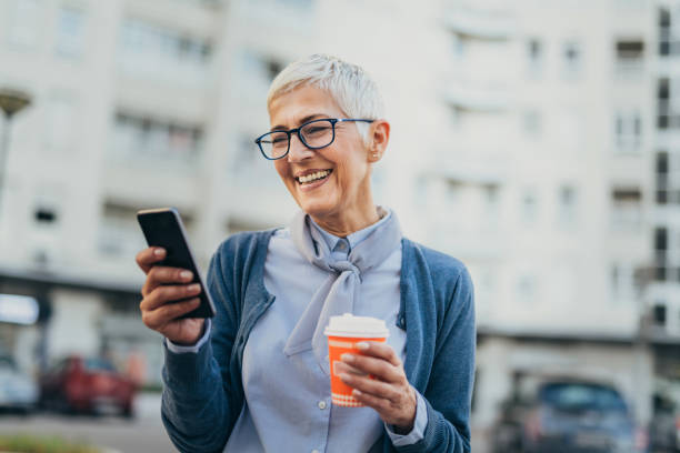 istock Senior woman usigg her smartphone 1058953748