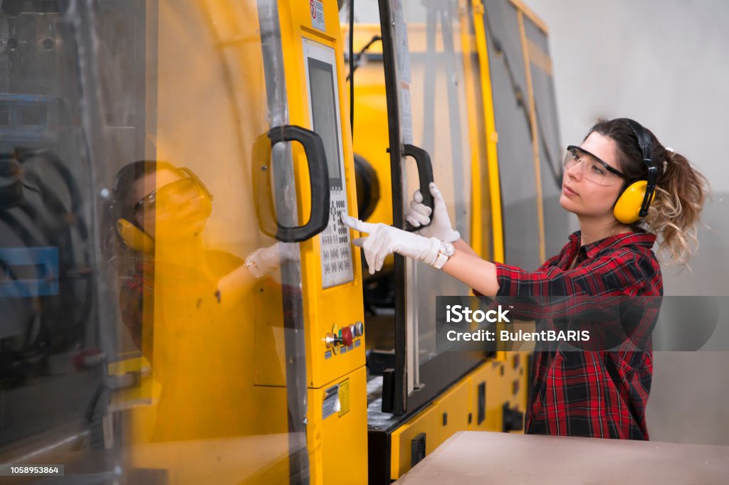 young mechanical engineer young mechanical engineer. Manufacturing Stock Photo