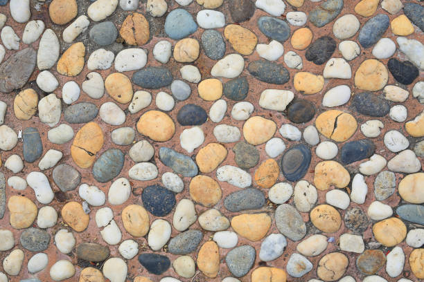 istock The abstract pattern of wall constructed with pebbles 1058954054