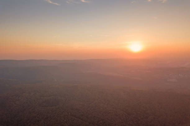 istock Sunset over Autumn forest. Aerial view autumn landscape 1058961028